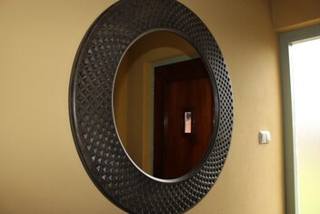 Round carved oak mirror